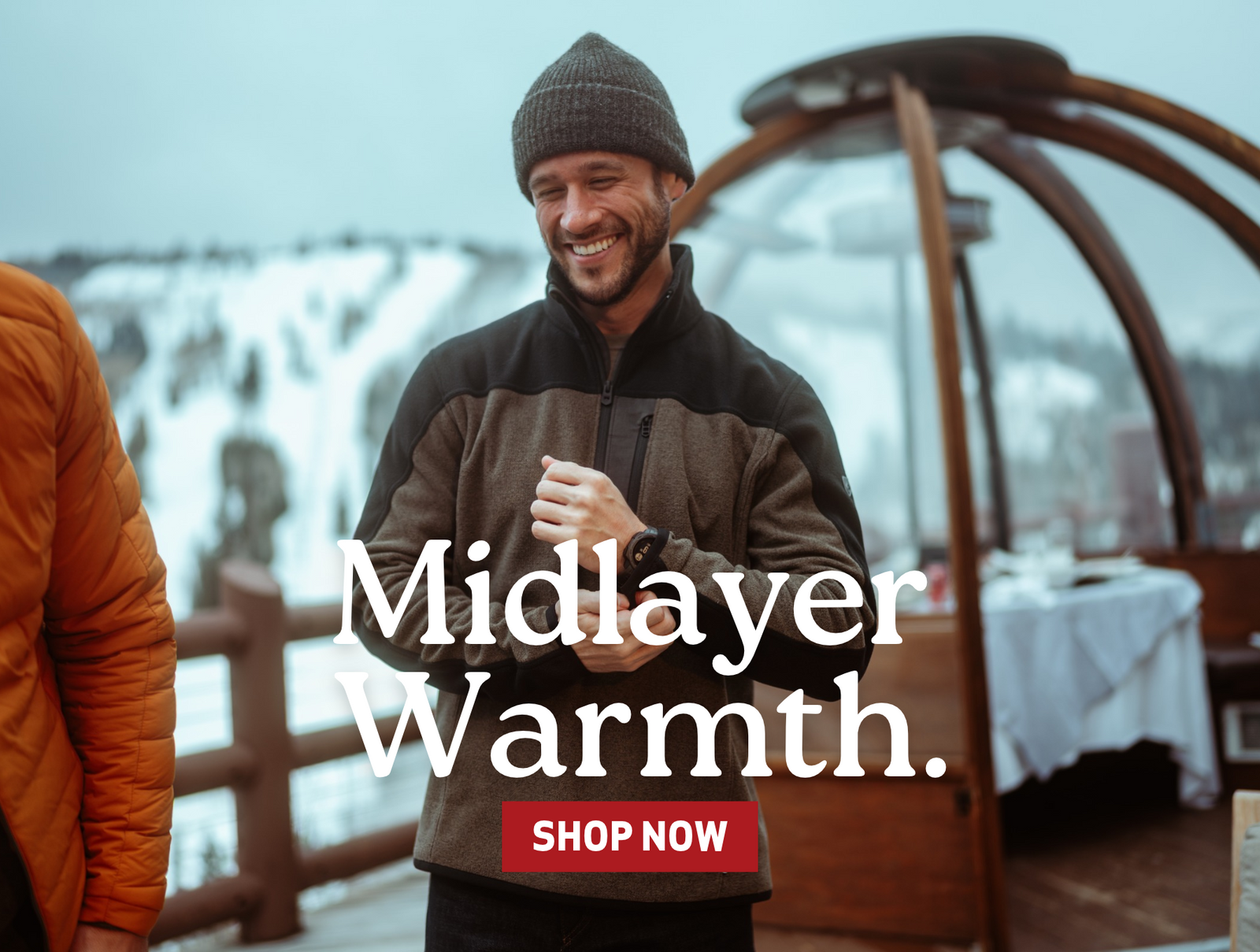 Male wearing Kuhl 1/4 zip fleece pullover in wintery environment. "Midlayer warmth - Shop now"